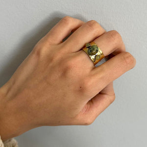 Close-up of hand wearing vintage-inspired green stone gold statement ring, adjustable 14k gold plated gemstone band, waterproof tarnish-free hypoallergenic jewelry, chunky boho Y2K ring, trendy everyday gold accessory with natural stone details for women