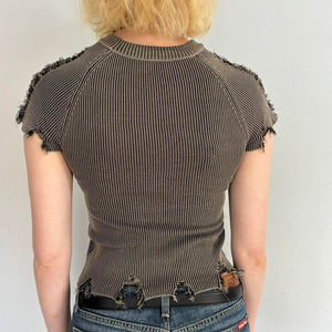 Back view of distressed ribbed baby tee in washed brown featuring raw frayed hems, stretchy fitted knit fabric, and vintage-inspired Y2K grunge style. Edgy indie sleaze women’s top with distressed detailing and flattering bodycon silhouette perfect for Pinterest-inspired outfits.