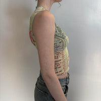 Side view of sheer butterfly mesh top, Y2K aesthetic sleeveless graphic tank, vintage inspired slim fit mesh shirt, abstract print polyester top, stretchy bodycon going out top, women’s trendy aesthetic clothing, Nuestro Amor Selectivos boutique style