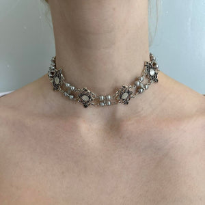 Antique-style silver pearl choker necklace for women with floral filigree accents, layered pearl chains, vintage statement jewelry, romantic coquette accessory, Victorian-inspired necklace, cottagecore fashion piece, and feminine silver choker.