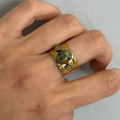 Gold adjustable statement ring with natural green stone detail, vintage-inspired boho jewelry, 14k gold plated waterproof hypoallergenic ring, trendy Y2K gemstone band styled on hand, tarnish-free everyday fashion accessory for women