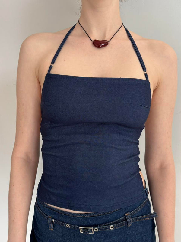 Navy blue Y2K halter top with adjustable straps, fitted backless tank top on model, minimalist aesthetic summer outfit, stretchy polyester cropped halter top paired with low-rise denim jeans, trendy going out top for women